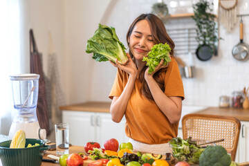 Wall Mural - Portrait of beauty body slim healthy asian woman having fun cooking and preparing cooking vegan food healthy eat with fresh vegetable salad on counter in kitchen at home.Diet.Fitness, healthy food