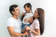 © Art_Photo - Portrait of enjoy happy love asian family father and mother holding hug cute little asian girl child smiling play and having fun moments good time, care, kid, support, insurance, child, at home