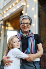 Sticker - Grandmother and granddaughter hugging, affection and love.