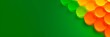 © MonkeyART - Orange and green color tablet pills isolated on green background. Banner with a place for text. Copy space. Healthcare and medicine concept