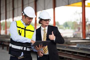 Caucasian construction architect Engineering man and busines owner in safety hardhat working at precast factory industrial. Heavy Industry Manufacturing Factory. Prefabricated concrete walls