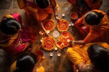 Diwali Hindu Festival Of Lights Celebration. Burning Diya Lamps And Women Making Rangoli