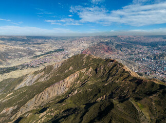 Wall Mural - Aerial view from the impressive landmark Muela del Diablo down into the valley with the highest capital and vibrant city La Paz and El Alto, Bolivia