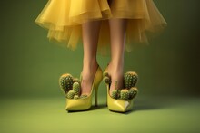 Woman In Funny Yellow High Heel Shoes And Yellow Dress, Shoes Filled With Cactus Plants, Humorous Minimal Concept Of Uncomfortable Shoes, Fashion Footwear Parody