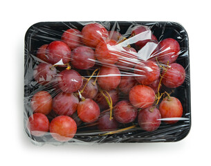 Wall Mural - Plastic package with ripe red grapes on white background