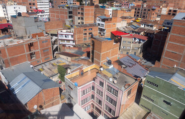 Wall Mural - La Paz, the highest administrative capital and vibrant city in Bolivia viewed from the red cable car / teleferico from the center to El Alto market