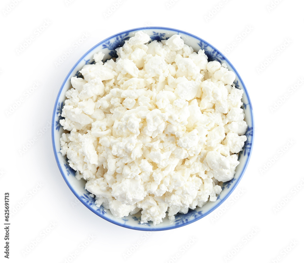 Bowl of tasty cottage cheese on white background