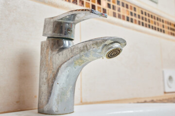 Wall Mural - Rusted faucet, macro shot of rusted faucet. Water scarcity and water consumption concept idea.