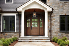 Main Entrance Door In House. Wooden Front Door With Gabled Porch And Landing. Exterior Of Georgian Style Home Cottage With White Columns And Stone Cladding. Created With Generative Ai