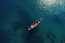 An Overhead View Of The Sea Blue With A Small Two-seater Boat In Sunny Day. Creative Nautical Wallpaper. Minimalist Style. Clear Blue Water With Little Waves.
