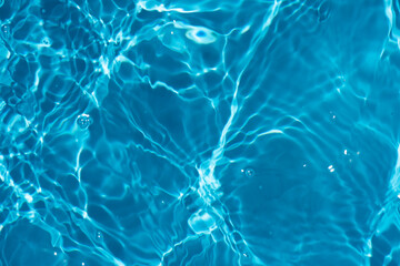 blue water with ripples on the surface. defocus blurred transparent blue colored clear calm water su