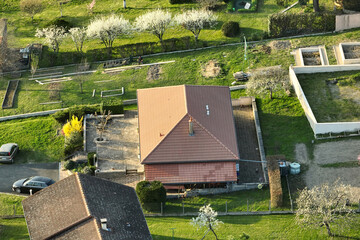 Wall Mural - Aerial view of residential houses in green suburban rural area