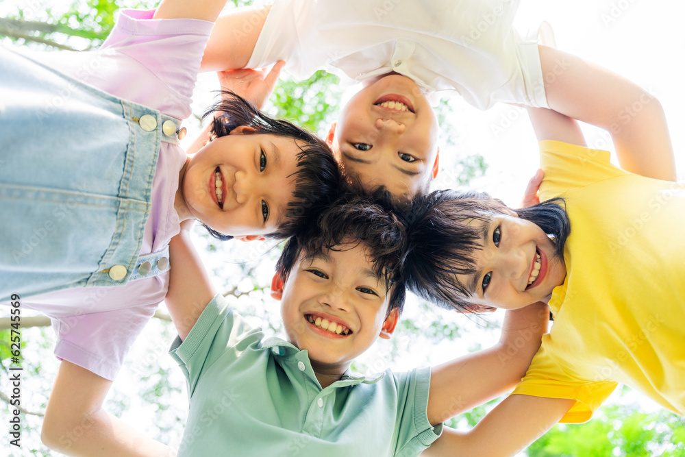 group of cute asian kids having fun in the park Stock Photo | Adobe Stock
