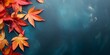 Leinwandbild Motiv Autumn background with colored red leaves on blue slate background. Top view, copy space, AI Generated