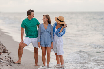 Wall Mural - Happy family on the beach during summer vacation