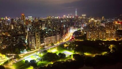 Wall Mural - Night skyline of Taipei, the capital city of Taiwan, with Guting Bikeway Bridge Observation Deck by an elevated expressway and 101 Tower among high rise buildings and dazzling lights in Xinyi District