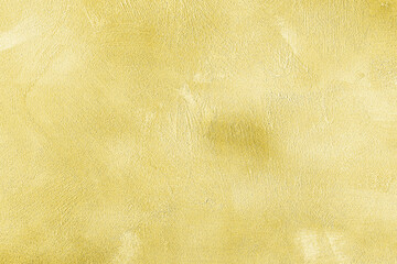 Texture of golden decorative plaster or concrete. Abstract gold grunge background.