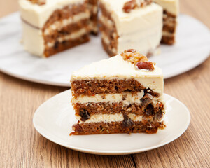 Classic carrot cake with cream cheese frosting, pecan, walnut and raisin