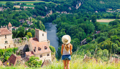 Wall Mural - Woman traveling in Europa- Lot in France ( Saint Cirq Lapopie)