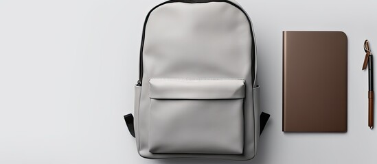 Aufkleber - Photo of a backpack and pen on a table with ample empty space for creative use with copy space