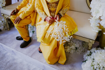 Wall Mural - Bride holding gentle wedding bouquet. Malay wedding ceremony. Selective focus.