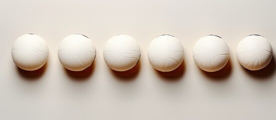 Poster - Photo of a row of white eggs on a table with plenty of space for your own message or design with copy space