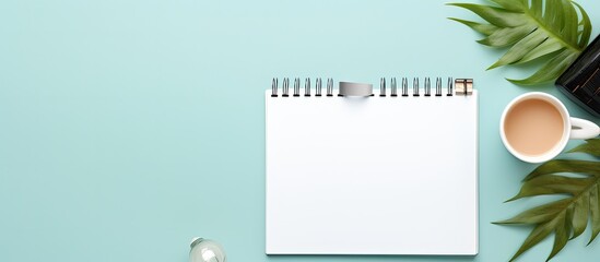 Poster - Photo of a desk with a notepad and a cup of coffee, perfect for a productive work day with copy space