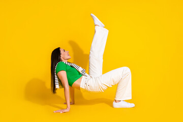 Poster - Full length photo of cool cheerful girl dressed white trousers having fun dancing isolated yellow color background