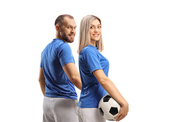 Poster - Male and female football players turning back to camera