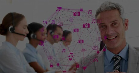 Poster - A businessman looking at the camera with his colleagues behind him