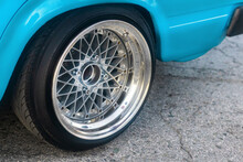 Low Profile Tire On Multi-spoke Sports Vehicle Rim Angle View
