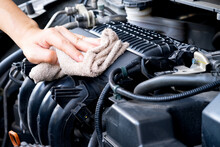 Hand Of A Man Holding A Blue Cloth Caring, Maintenance Car And Cleaning And Engine Car Room	