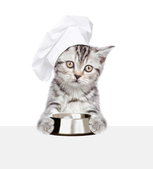 Poster - Cat wearing chef's hat holding empty bowl and looking above empty white banner. isolated on white background