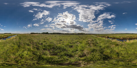 Wall Mural - spherical 360 hdri panorama among green grass farming field near melioration reclamation canal in eq