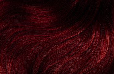 dark red hair close-up as a background. women's long brown hair. beautifully styled wavy shiny curls