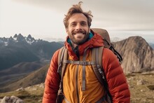 Handsome Young Man With Backpack On The Background Of Mountains.