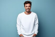 © AnaWein - Young man wearing white sweatshirt mockup, at blue background. Design pullover template, print presentation mock-up. AI generated.
