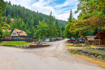 a rustic mountainside rv park and campground at wolf lodge bay near the lake in coeur d'alene, idaho