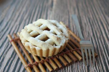 Wall Mural - Homemade apple pie with lattice pastry on table 