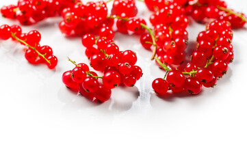 Poster - Red currant berries isolated on white background. Fresh and juicy organic redcurrant berry macro shot. Tasty vegan food border design