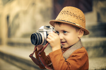 Autumn portrait of cute little caucasian boy outdoor