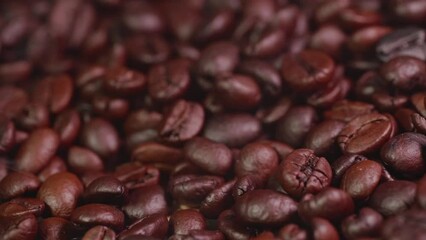 Wall Mural - Roast coffee beans with faint smoke or steam from baking. Roast coffee beans before blending or grinding them to make fresh coffee, espresso or drip.	