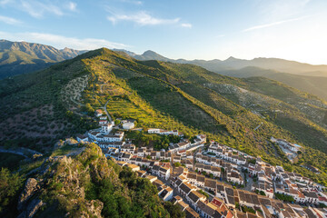 Canvas Print - Aerial view of Zahara de la Sierra white houses and hills - Zahara de la Sierra, Andalusia, Spain