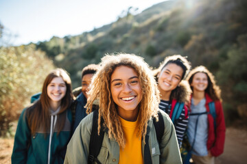 Diverse group of teenagers hiking and enjoying nature, a group of young friends exploring the great outdoors, embracing an active lifestyle in nature