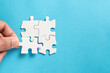 © Kenishirotie - Four pieces of plain white jigsaw puzzle for business concept