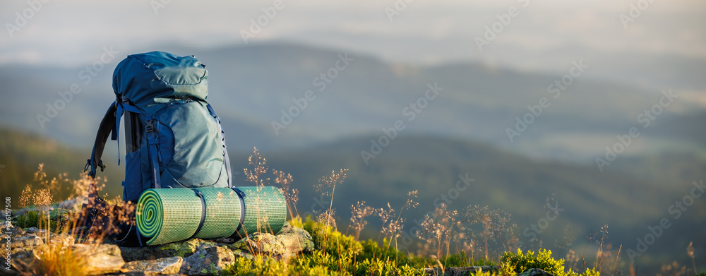 Trek Def Hiking backpack with sleeping pad during trek in mountain. Camping and ...