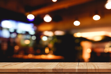 wooden table with blurred bar background