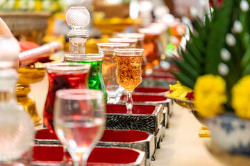 Beautiful liquor glass on the ritual table to be used in Asian celebrations.