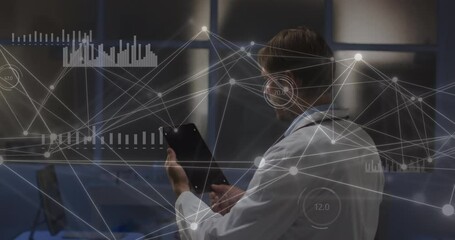 Wall Mural - Animation of data and network of connections over caucasian male doctor using tablet