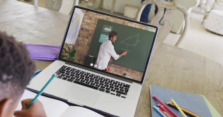 Poster - Diverse male student having class during laptop video call with male teacher in slow motion